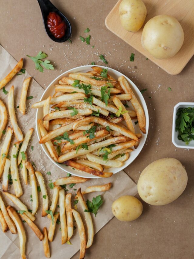 potato fries and sliced potato on white ceramic plate