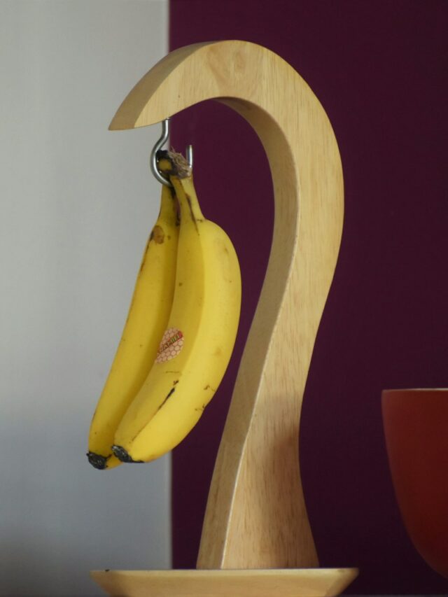 hanging yellow bananas on desk